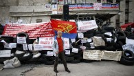 A pro-Russia protester stands at a barricade outside a regional government building in Donetsk